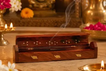 Wooden incense holder designed to support an agarbatti stick and catch ash