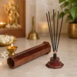 Tall wooden tower shaped incense holder with decorative openings