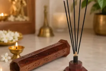 Tall wooden tower shaped incense holder with decorative openings