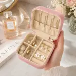 Small pink jewellery box with divided storage for rings earrings and chains
