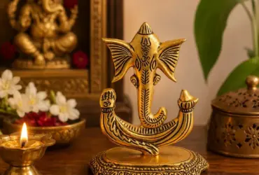 Compact Ganesh decorative plate with antique-gold-coloured finish