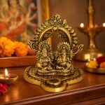 Gold-coloured Lakshmi Ganesh idol composition with ornate arch
