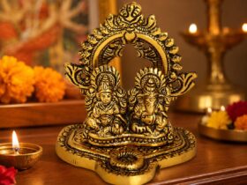 Gold-coloured Lakshmi Ganesh idol composition with ornate arch