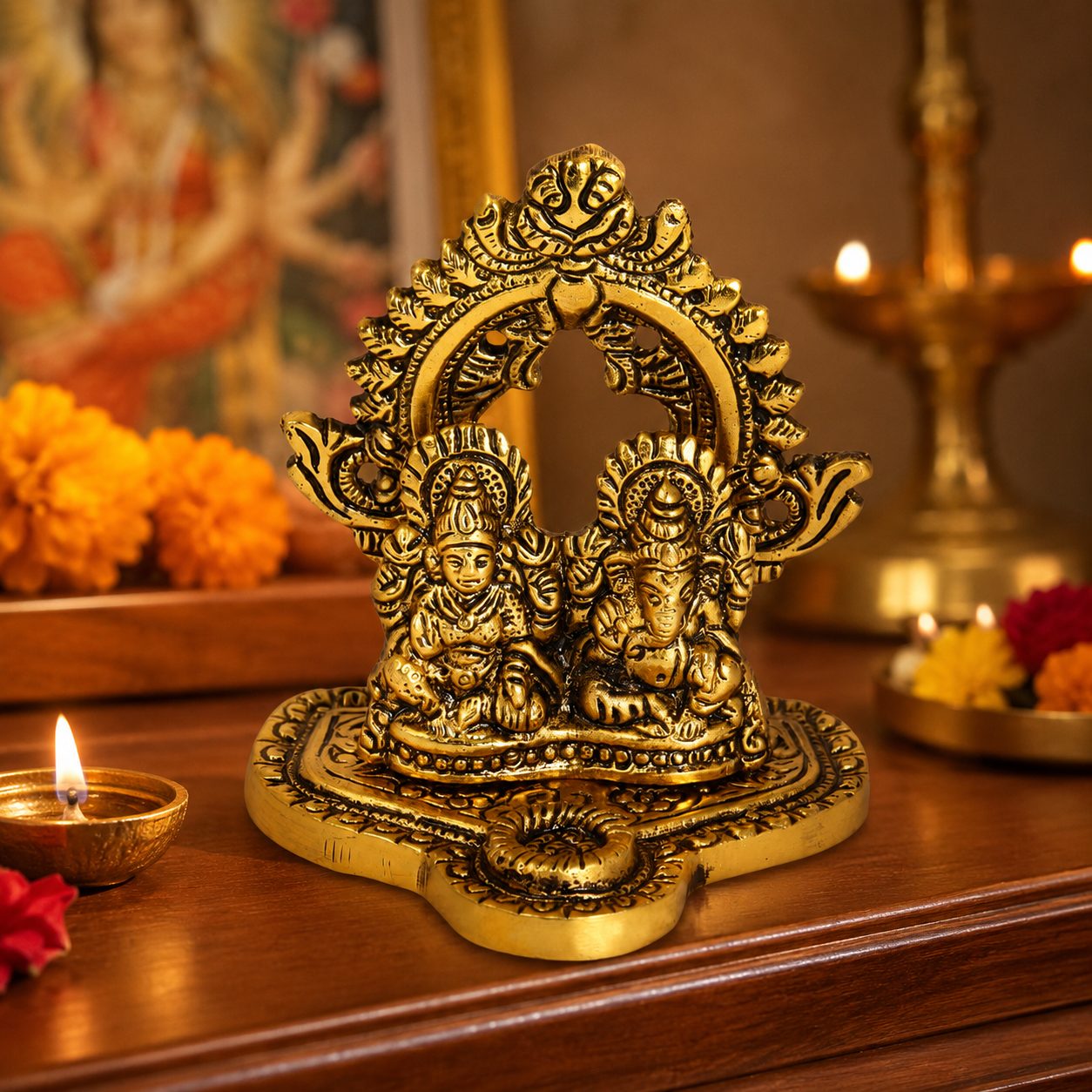 Gold-coloured Lakshmi Ganesh idol composition with ornate arch