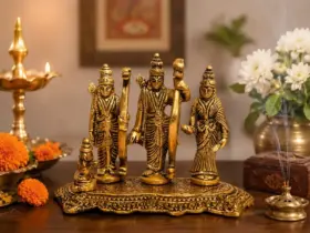 Gold-coloured Ram Darbar composition for a home mandir shelf