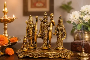 Gold-coloured Ram Darbar composition for a home mandir shelf